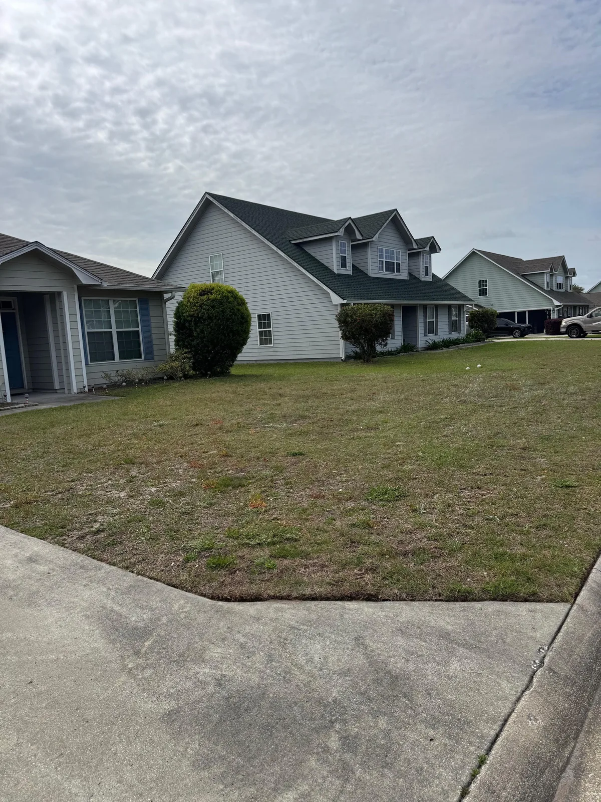 Residential neighborhood property with lawn and driveway